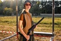 Portrait of confident caucasian woman on tactical gun training classes, posing