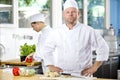 Portrait of confident chef making food in large kitchen Royalty Free Stock Photo