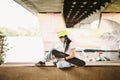 Portrait confident, cool young female skateboarder at outdoor skate park. Urban girl with skate board on half pipe ramp. lifestyle Royalty Free Stock Photo