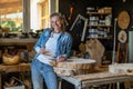 Portrait of confident craftswoman in her workshop Royalty Free Stock Photo