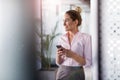 Business woman using smartphone in office Royalty Free Stock Photo