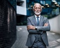 Portrait of confident entrepreneur standing on walkway outside modern office buildings Royalty Free Stock Photo