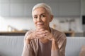 Portrait of confident european senior lady with stylish haircut indoor Royalty Free Stock Photo