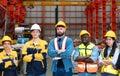 Portrait of confident factory workers standing with arms crossed