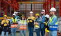 Portrait of confident factory workers standing with arms crossed