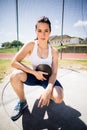 Portrait of confident female athlete holding a discus Royalty Free Stock Photo