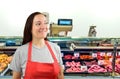 Female butcher looking askance Royalty Free Stock Photo