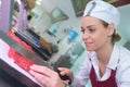 Portrait confident female butcher working in kitchen Royalty Free Stock Photo