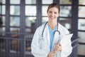 Portrait of confident female doctor holding clipboard Royalty Free Stock Photo