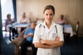 Portrait of confident female doctor standing with arms crossed Royalty Free Stock Photo