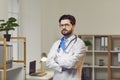 Portrait of confident male doctor standing with his arms crossed Royalty Free Stock Photo