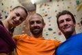 Portrait of confident male trainer with athletes in gym Royalty Free Stock Photo