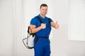 Confident Male Worker Carrying Pesticide Container Royalty Free Stock Photo