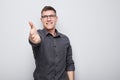 Portrait of confident man chooses you points finger at camera isolated on white studio background. Welcome gesture Royalty Free Stock Photo