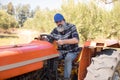 Portrait of confident man sitting in tractor Royalty Free Stock Photo