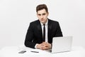 Portrait of confident manager sitting at desk and looking at camera. Portrait of business man working at computer Royalty Free Stock Photo