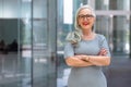 Portrait of a confident mature business person standing outside office workspace, bank, financial institution Royalty Free Stock Photo