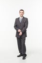 Portrait of confident mature businessman standing isolated over white background Royalty Free Stock Photo