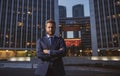 Portrait of a confident mature businessman standing outside office. Smiling business man CEO standing with arms crossed Royalty Free Stock Photo