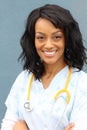 Portrait Of A Confident Mature Female African Doctor Looking At Camera Isolated On Blue Background Royalty Free Stock Photo