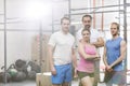 Portrait of confident men and women standing at crossfit gym Royalty Free Stock Photo