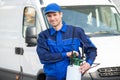 Pest Control Worker With Pesticide Against Truck Royalty Free Stock Photo