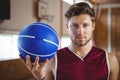 Portrait of confident player holding basketball Royalty Free Stock Photo