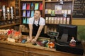 Portrait of confident salesperson in coffee store