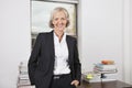 Portrait of confident senior businesswoman with arms crossed in office Royalty Free Stock Photo