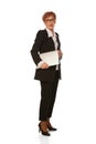 Portrait of confident senior executive manager. Stylish middle age woman in black business suit posing isolated on white Royalty Free Stock Photo