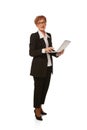 Portrait of confident senior executive manager. Stylish middle age woman in black business suit posing isolated on white Royalty Free Stock Photo