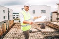 confident and smiling man, engineer working on construction site Royalty Free Stock Photo