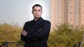 Portrait of confident strong caucasian businessman adult brunet man guy wears formal black suit posing with crossed arms Royalty Free Stock Photo