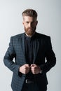Portrait of confident stylish bearded man in suit