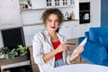 Portrait of confident stylish business woman is making notes, looking at the camera, smiling. Successful young female Royalty Free Stock Photo