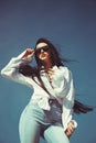 Portrait confident successful beautiful attractive brunette young woman fashion girl model posing with sunglasses. Royalty Free Stock Photo