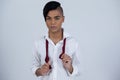 Portrait of confident transgender female holding red tie