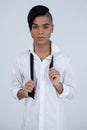 Portrait of confident transgender female holding tie