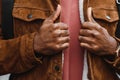 portrait of confident trendy serious african guy in stylish outfit, young afro american male posing at camera, looking Royalty Free Stock Photo