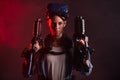 Portrait of confident woman with guns for VR game Royalty Free Stock Photo