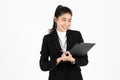 Portrait of confident young Asian business woman holding document folder or ring binder posing over white isolated background Royalty Free Stock Photo