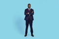 Portrait Of Confident Young Black Businessman In Suit Standing With Folded Arms Royalty Free Stock Photo