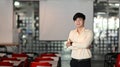 Portrait of a confident young businessman is standing with arms crossed in meeting room. Royalty Free Stock Photo