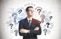 Confident man and question marks Royalty Free Stock Photo