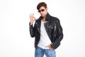Portrait of a confident young man in a leather jacket Royalty Free Stock Photo
