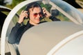 Portrait of confident young man pilot in small plane Royalty Free Stock Photo