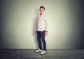 Full length man standing isolated on gray background grey floor in studio Royalty Free Stock Photo