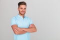 Portrait of confident young man wearing light blue polo t-shirt Royalty Free Stock Photo