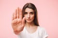 Portrait of a confident young woman showing stop Royalty Free Stock Photo