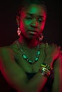 Confident Woman Wearing Jewelry Over Black Background